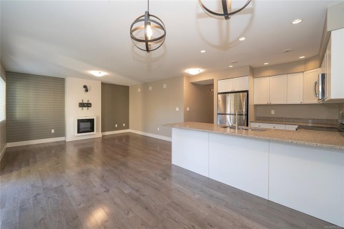 2121 Charters Rd, Sooke, BC - Indoor Photo Showing Kitchen With Fireplace