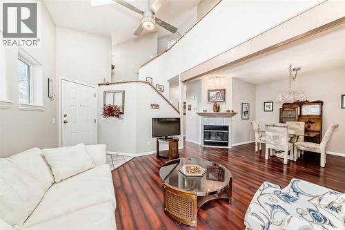 Living room - 1906 Patterson View Sw, Calgary, AB - Indoor Photo Showing Living Room With Fireplace