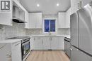 96 Covington Road Ne, Calgary, AB  - Indoor Photo Showing Kitchen With Upgraded Kitchen 