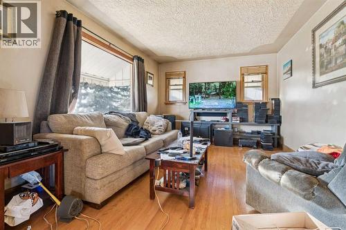 450 34 Avenue Nw, Calgary, AB - Indoor Photo Showing Living Room With Fireplace