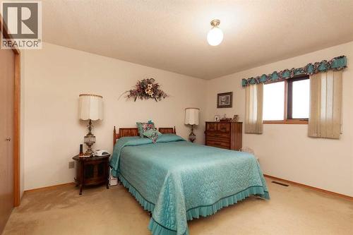 Primary Bedroom - 83 Elm Crescent S, Lethbridge, AB - Indoor Photo Showing Bedroom