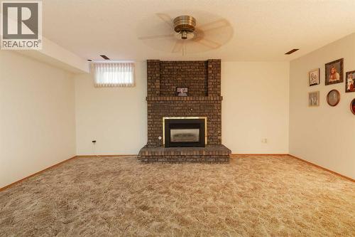 83 Elm Crescent S, Lethbridge, AB - Indoor With Fireplace