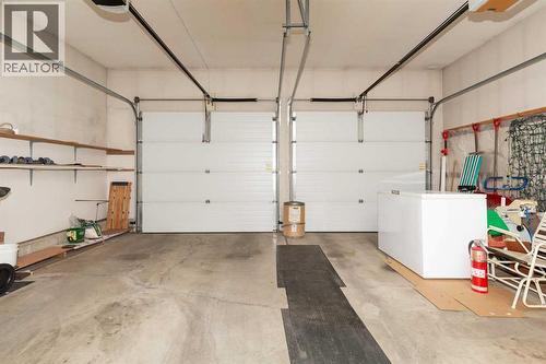 double garage - 83 Elm Crescent S, Lethbridge, AB - Indoor Photo Showing Garage