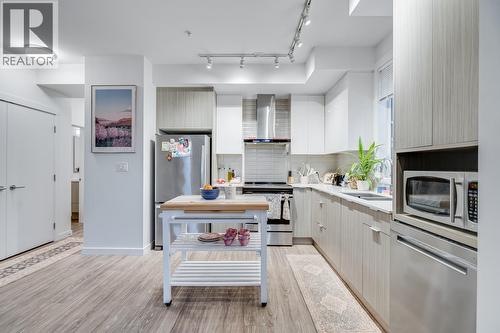 Spacious, functional kitchen - 1800 Richter Street Unit# 115, Kelowna, BC - Indoor Photo Showing Kitchen With Upgraded Kitchen