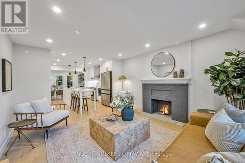 22 Harvard Avenue, Ottawa, ON - Indoor Photo Showing Living Room With Fireplace