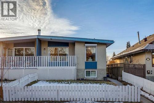 Welcome to 23 Dovercliffe Way with front and backyards fenced and front balcony - 23 Dovercliffe Way Se, Calgary, AB - Outdoor With Deck Patio Veranda With Exterior