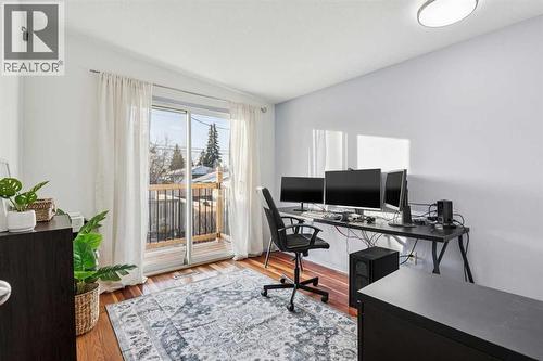 Bedroom/Office on main level with backyard access - 23 Dovercliffe Way Se, Calgary, AB - Indoor Photo Showing Office