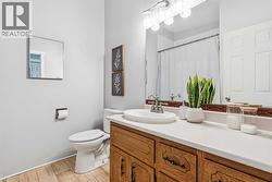 Main floor bathroom with tub/shower combo - 