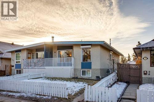 Bi-level duplex with freshly painted front fence - 23 Dovercliffe Way Se, Calgary, AB - Outdoor With Deck Patio Veranda