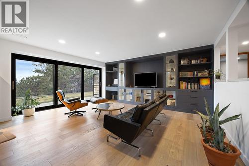 Recreation/entertainment space on the lower level with easy access to the flat front yard - 1632 Griffiths Place, West Kelowna, BC - Indoor