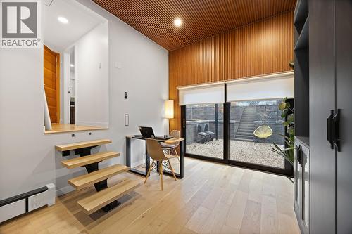 Primary bedroom with it's own laundry & patio access! - 1632 Griffiths Place, West Kelowna, BC - Indoor Photo Showing Other Room