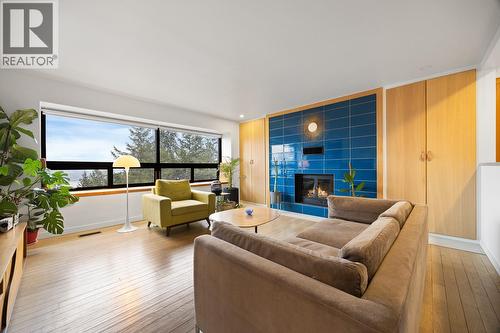 Stylish living room on the upper level with lake views - 1632 Griffiths Place, West Kelowna, BC - Indoor Photo Showing Living Room With Fireplace