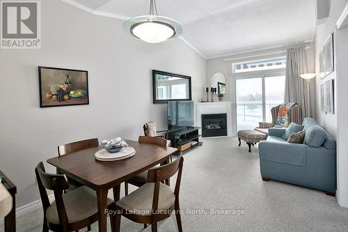 402 - 34 Bayfield Street, Meaford, ON - Indoor Photo Showing Dining Room With Fireplace