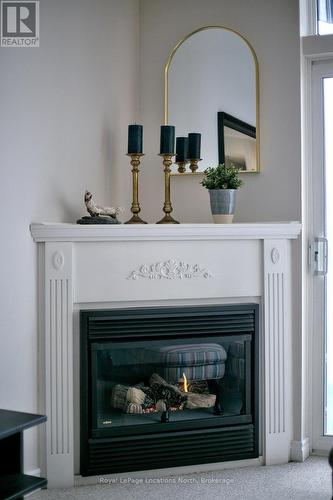 402 - 34 Bayfield Street, Meaford, ON - Indoor Photo Showing Living Room With Fireplace