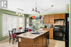 Kitchen Area with Gas stove and Island Double sink - 