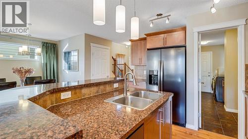 157 Bridleridge View Sw, Calgary, AB - Indoor Photo Showing Kitchen With Double Sink