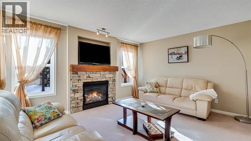 157 Bridleridge View Sw, Calgary, AB - Indoor Photo Showing Living Room With Fireplace