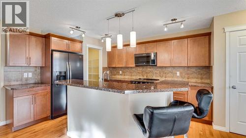 157 Bridleridge View Sw, Calgary, AB - Indoor Photo Showing Kitchen With Upgraded Kitchen