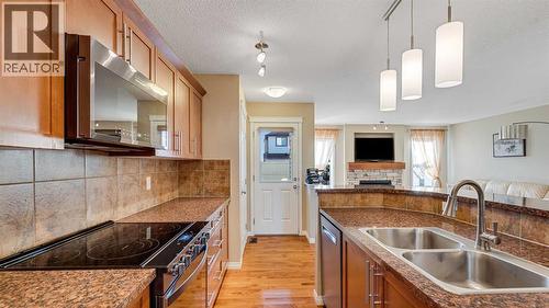 157 Bridleridge View Sw, Calgary, AB - Indoor Photo Showing Kitchen With Double Sink