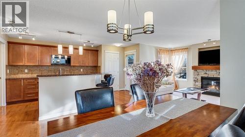 157 Bridleridge View Sw, Calgary, AB - Indoor Photo Showing Other Room With Fireplace