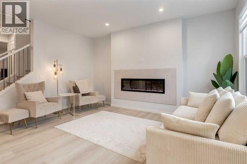 29 Marmot Passage Nw, Calgary, AB - Indoor Photo Showing Living Room With Fireplace