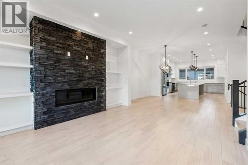 2409 28 Avenue Sw, Calgary, AB - Indoor Photo Showing Living Room With Fireplace