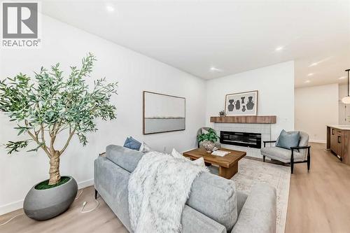 8530 Bowness Road Nw, Calgary, AB - Indoor Photo Showing Living Room With Fireplace