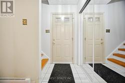 Bright Foyer With Tile Floor - 