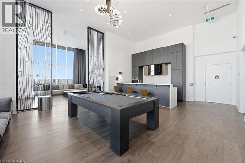 Rec room with pool table, a towering ceiling, - 297 Oak Walk Drive Unit# 2407, Oakville, ON - Indoor Photo Showing Other Room