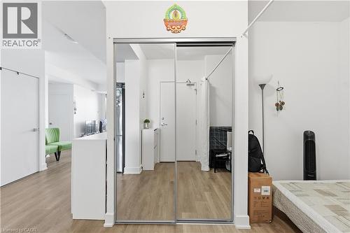 Front hall closet with a spacious den to the right, which can be used as a second bedroom - 297 Oak Walk Drive Unit# 2407, Oakville, ON - Indoor