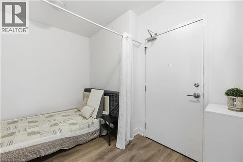 This versatile den can serve as a home office, storage space, secondary lounge, or second bedroom - 297 Oak Walk Drive Unit# 2407, Oakville, ON - Indoor Photo Showing Bedroom