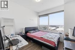 pacious bedroom with floor-to-ceiling windows and high-end modern window coverings - 