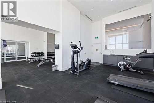 Exercise room featuring recessed lighting and a towering ceiling - 297 Oak Walk Drive Unit# 2407, Oakville, ON - Indoor Photo Showing Gym Room
