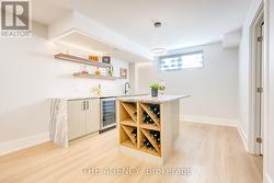 Basement Wet Bar w/leather textured quartzite - 
