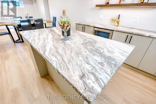 Basement Wet Bar w/leather textured quartzite - 519 Third Line, Oakville, ON - Indoor Photo Showing Kitchen