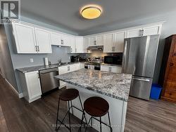 Lower level kitchen. - 