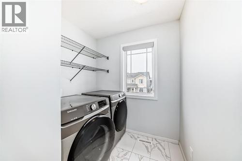 140 Carringham Road Nw, Calgary, AB - Indoor Photo Showing Laundry Room