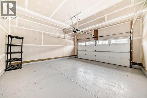 140 Carringham Road Nw, Calgary, AB - Indoor Photo Showing Garage