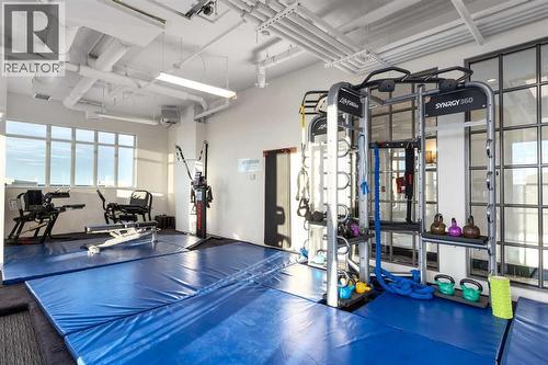 Fitness centre with a view - 2208, 930 6 Avenue Sw, Calgary, AB - Indoor Photo Showing Gym Room