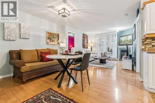 105, 15320 Bannister Road Se, Calgary, AB - Indoor With Fireplace