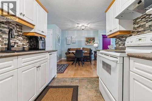 105, 15320 Bannister Road Se, Calgary, AB - Indoor Photo Showing Kitchen