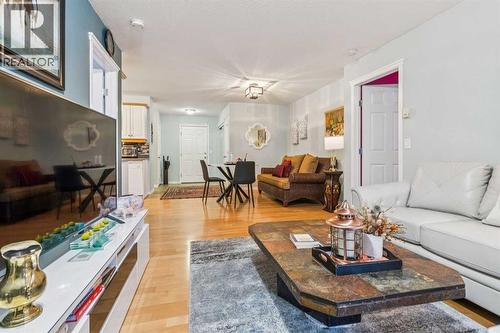 105, 15320 Bannister Road Se, Calgary, AB - Indoor Photo Showing Living Room