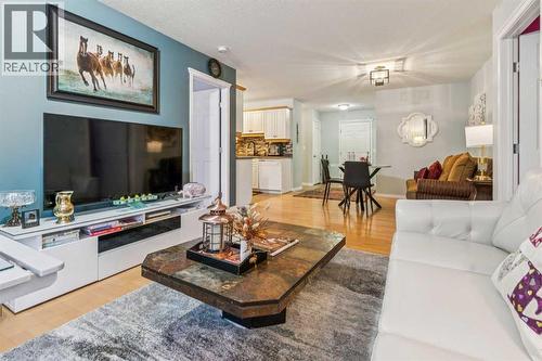 105, 15320 Bannister Road Se, Calgary, AB - Indoor Photo Showing Living Room