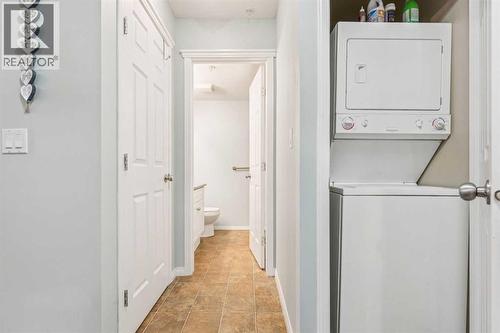 105, 15320 Bannister Road Se, Calgary, AB - Indoor Photo Showing Laundry Room
