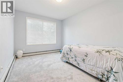 105, 15320 Bannister Road Se, Calgary, AB - Indoor Photo Showing Bedroom