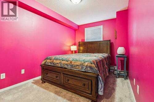 105, 15320 Bannister Road Se, Calgary, AB - Indoor Photo Showing Bedroom