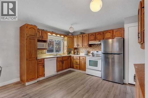 108 Whiteglen Crescent Ne, Calgary, AB - Indoor Photo Showing Kitchen With Double Sink
