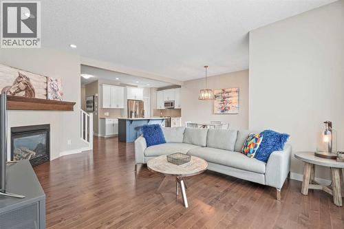 Gas fireplace - 308 Chaparral Valley Way Se, Calgary, AB - Indoor Photo Showing Living Room With Fireplace
