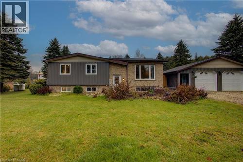 View of front facade featuring a front lawn and driveway - 230 Saugeen Street, Grey Highlands, ON - Outdoor