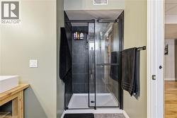 Bathroom featuring vanity and a shower stall - 
